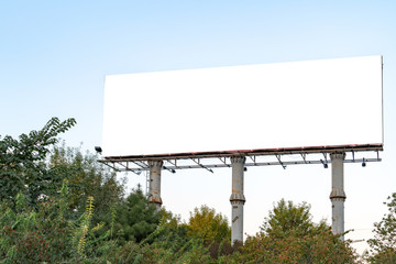 Blank billboard on blue sky background for new advertisement