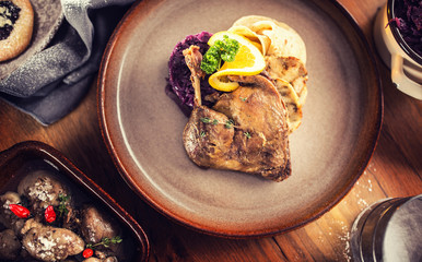 Top of view roasted christmas duck red cabbage dumplings liver draft beer and baked buns