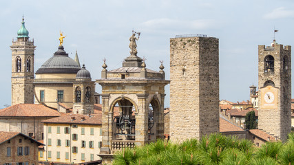 Fototapeta na wymiar Bergamo, Italy. The old town. Landscape at the city center, the old towers and the clock towers from the ancient fortress