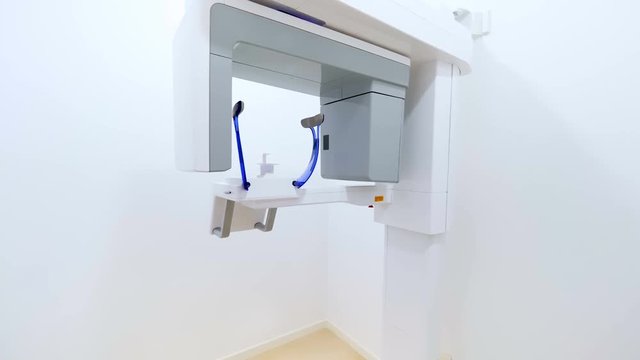 Dental tac with cephalometric panorama x-ray machine in a clinic.