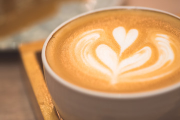 Close up latte coffee on the working table..