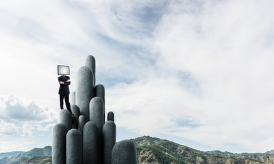 Businessman with TV instead of head.