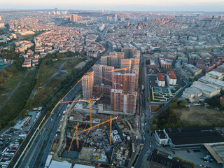 Aerial top view of construction site with cranes