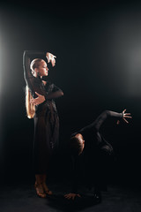 Beauty, fashion. Dancing over black background, beautiful couple of ballet dancers