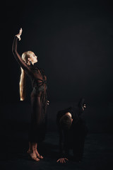 Beauty, fashion. Dancing over black background, beautiful couple of ballet dancers