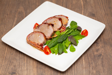 Roasted Pork Tenderloin Wrapped in bacon with lettuce and tomatoes