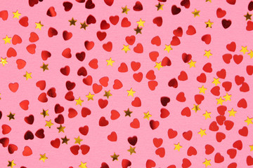 Pink background with red confetti hearts for Valentine Day	
