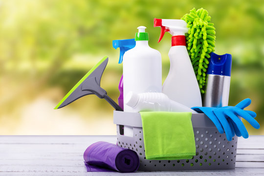 Cleaning concept of cleaning supplies needed to spring cleaning. Cleaning equipment at spring background.