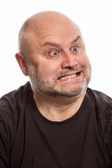 Obraz premium A bald man makes a face, close-up