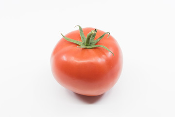 Single red truss tomato on white background