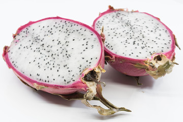 Dragon Fruit  sliced in half showing white flesh and black seeds