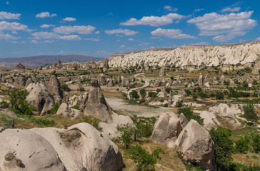 Fototapeta na wymiar Goreme, Turkey - A Unesco World Heritage site, Cappadocia is famous for its fairy chimneys, churches and castles carved in the rock, and a unique heritage