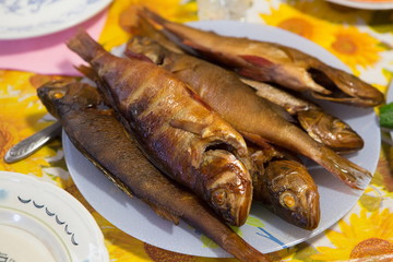 Smoked fish cooked in a home smokehouse