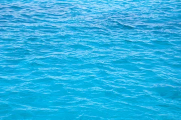 Foto op Aluminium Oceaan turkoois blauwe oppervlakte kalme golven © Jezper