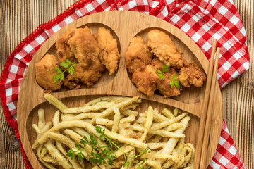 Chicken nuggets with yellow beans.
