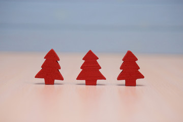 Red christmas tree toys decoration on wooden blue