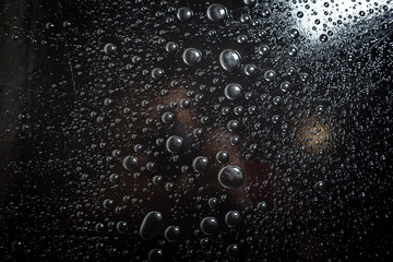 Water droplets on black background