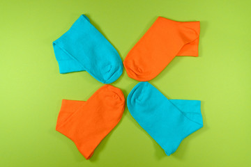 four new socks orange, blue