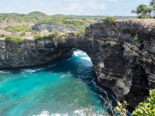 Beautiful natural sea pool Broken Bay. Bali travel destination. Nusa Penida island day tour popular place. Activity on beach holiday with kids. Indonesia, october, 2018