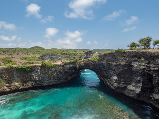 Beautiful natural sea pool Broken Bay. Bali travel destination. Nusa Penida island day tour popular place. Activity on beach holiday with kids. Indonesia, october, 2018