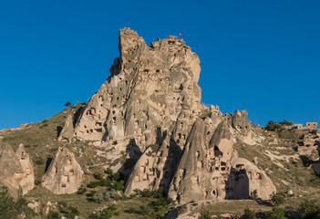 Fototapeta na wymiar Uçhisar, Turkey - A Unesco World Heritage site, Cappadocia is famous for its fairy chimneys, churches and castles carved in the rock, and a unique heritage