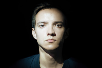 Obraz premium dramatic portrait of a young man.