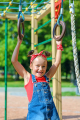 little girl is playing on the playground
