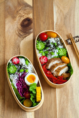 Japanese bento box with chicken, vegetables and rice