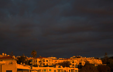 Dark sky before thunderstorm in the light of sunset