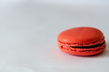 Red macaroons is on the white background.