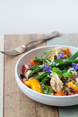 Italian panzanella bread and tomato salad with roast peppers, asparagus, parmesan and micro greens