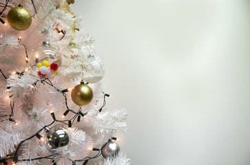 White christmas and balls , pom poms on fir branches with copy space
