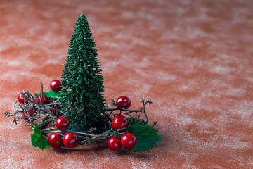 Holiday composition with christmas tree and wreath with holly berries, horizontal copy space