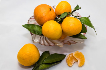 Fresh tangerines with green leaves