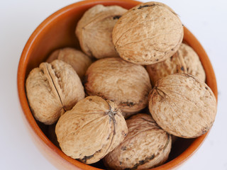 Organic walnuts in a ceramic bowl