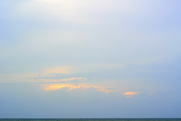 Beautiful clouds over the ocean surface after the sunset. Natural background.