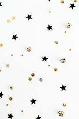 Festive holiday background with sparkle glitter decoration. Flat lay, top view Christmas or New Year pattern.