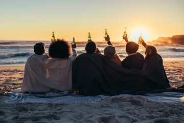 Best friends having party at beach in evening