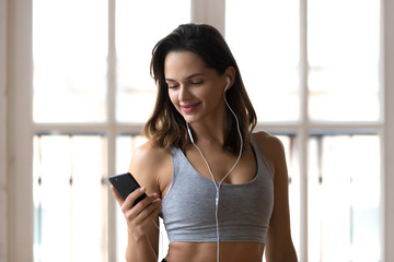 Head shot portrait attractive slim young woman starts day with workout feels satisfied and healthy....