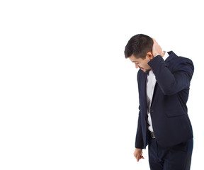 A isolated confused indecision man in a business suit touches his head with his hand expressing anxiety and doubt on white background. 