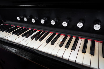Fototapeta na wymiar Detail of the keyboard of an ancient organ.