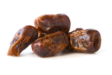 Dried halawi dates on a white