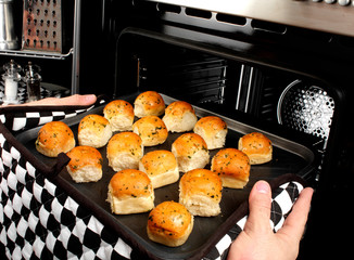 MAN BAKING GARLIC DOUGH BALLS