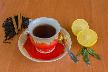 Cup of tea on a wooden background.