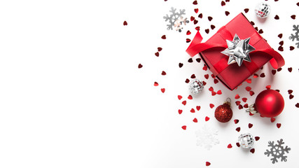 Merry Christmas and Happy Holidays greeting card. New Year. Valentine's day. Red gift, present on white background top view. Winter holidays.