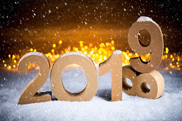 2019 happy new year christmas 2018 change greeting card number symbol lettering wooden lights bokeh snow background
