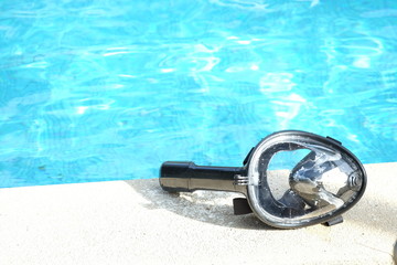 Full face snorkel mask on swimming pool.