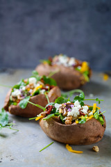 Baked sweet potato with salad
