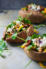 Baked potatoes filled with salad and fresh vegetables