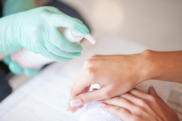 Obraz na płótnie Canvas Woman Hand Care. Applying Peeling Scrub or Moisturizing Cream on to the Hands